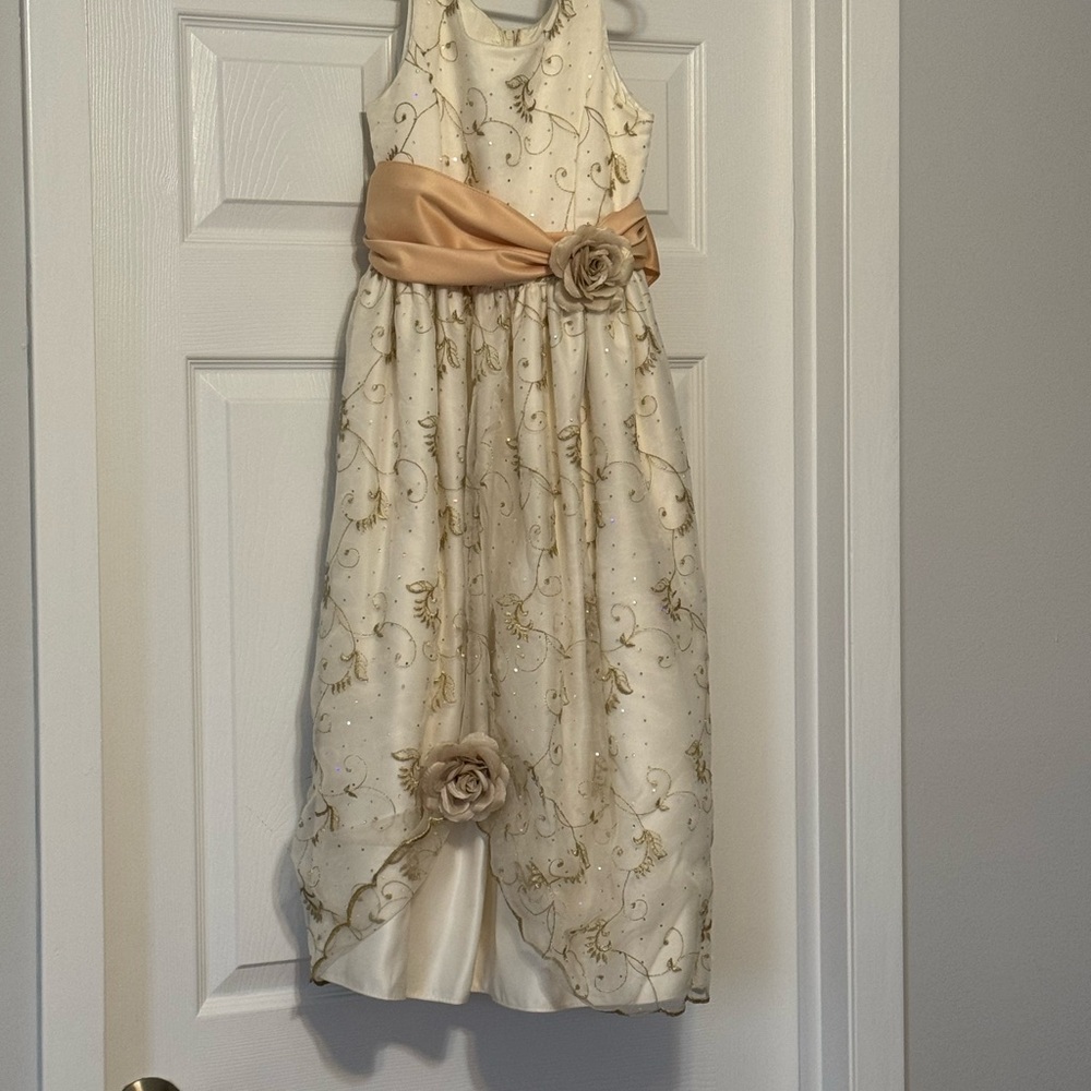 Cream colored formal dress for children. The namebrand is cozy cozy.